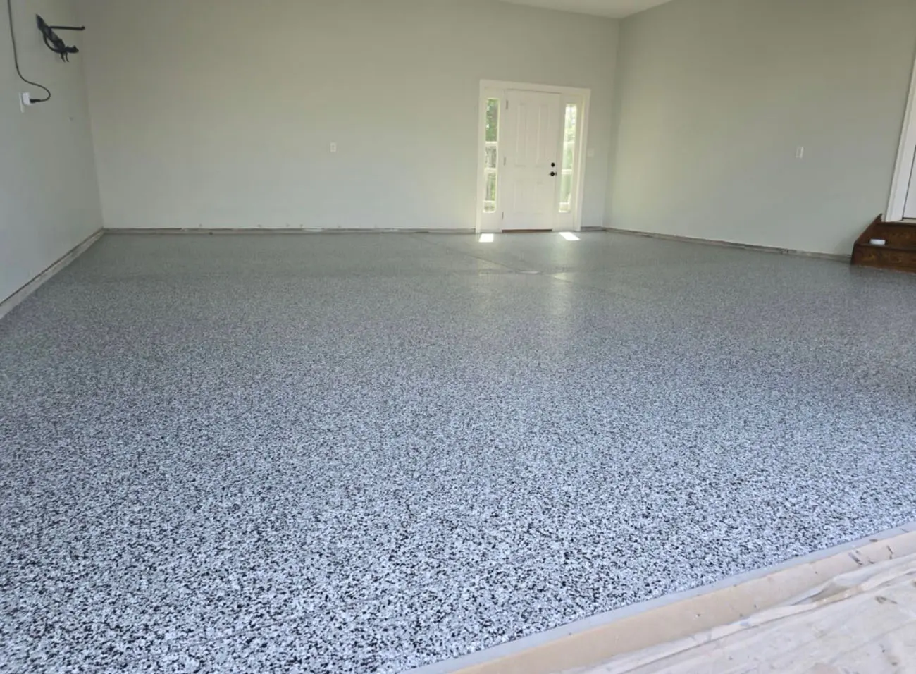 Residential floor coating transformation by Yukon Concrete Coatings
